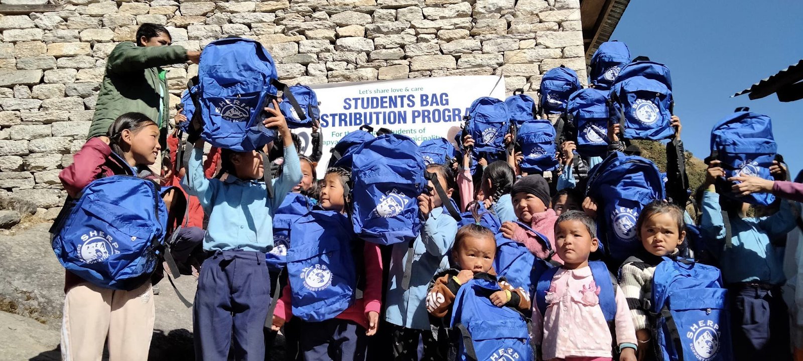 Kids of rural nepal with bags in hand