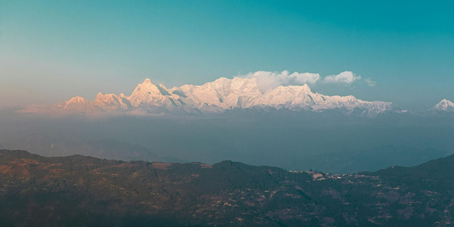Wide panorama of snow-capped Himalayan range including Ganesh Himal at sunrise from Nagarkot
