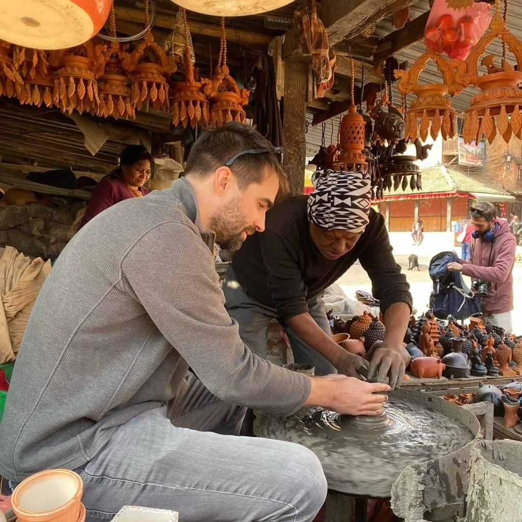 tourist enjoying pottery making in bhaktapur