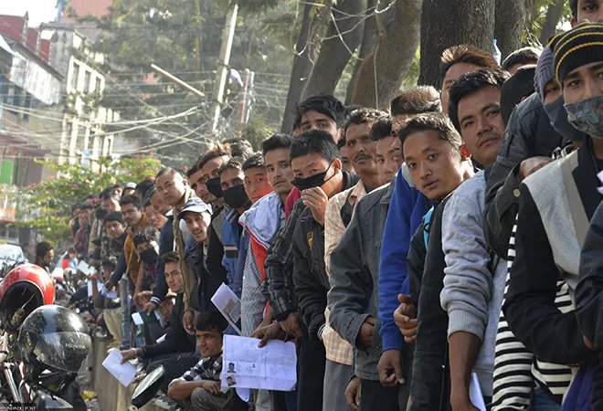 youth standing in queue for migration process