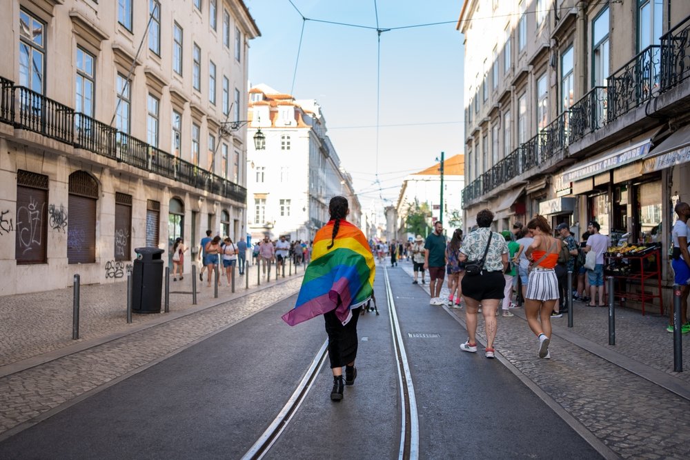 Girl walking with LGBT flag