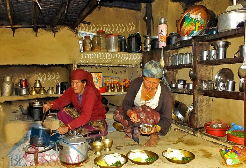 Women cooking Dal-Bhat at homestay.