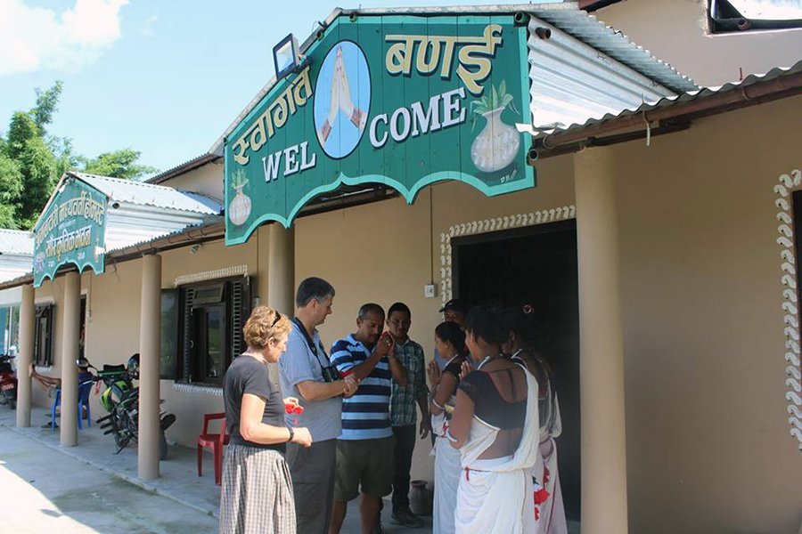 host welcoming guest at homestay