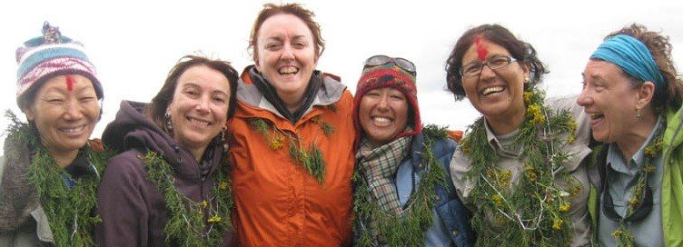 happy tourists with women homestay owners